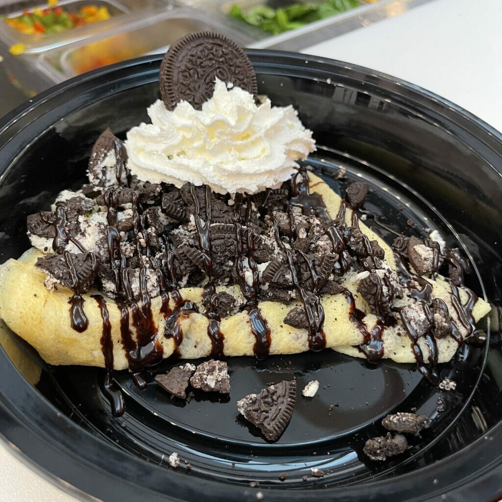 FInd a crepe with Oreo cookies, whipped cream, chocolate syrup and powdered sugar on top at Easton.