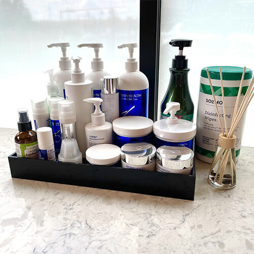 Facial care products on a counter inside Boss Gal Beauty Bar at Easton.