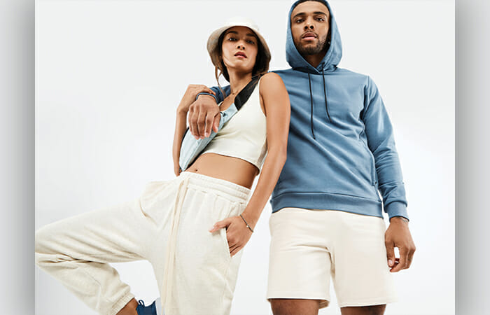 A man and a women wearing Fabletics clothing.