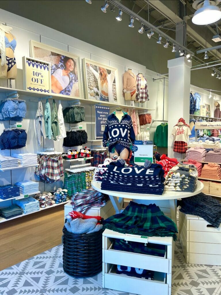 Display of sweaters on a table.