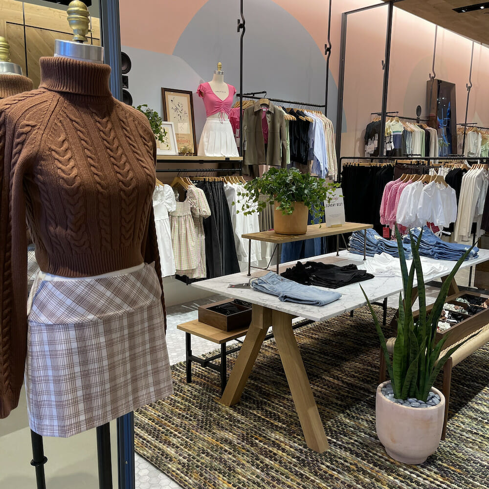 Clothes on display inside Aritzia at Easton Town Center. 