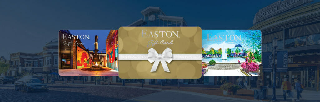 Three Easton Gift Cards against a blue background of the Station Building.