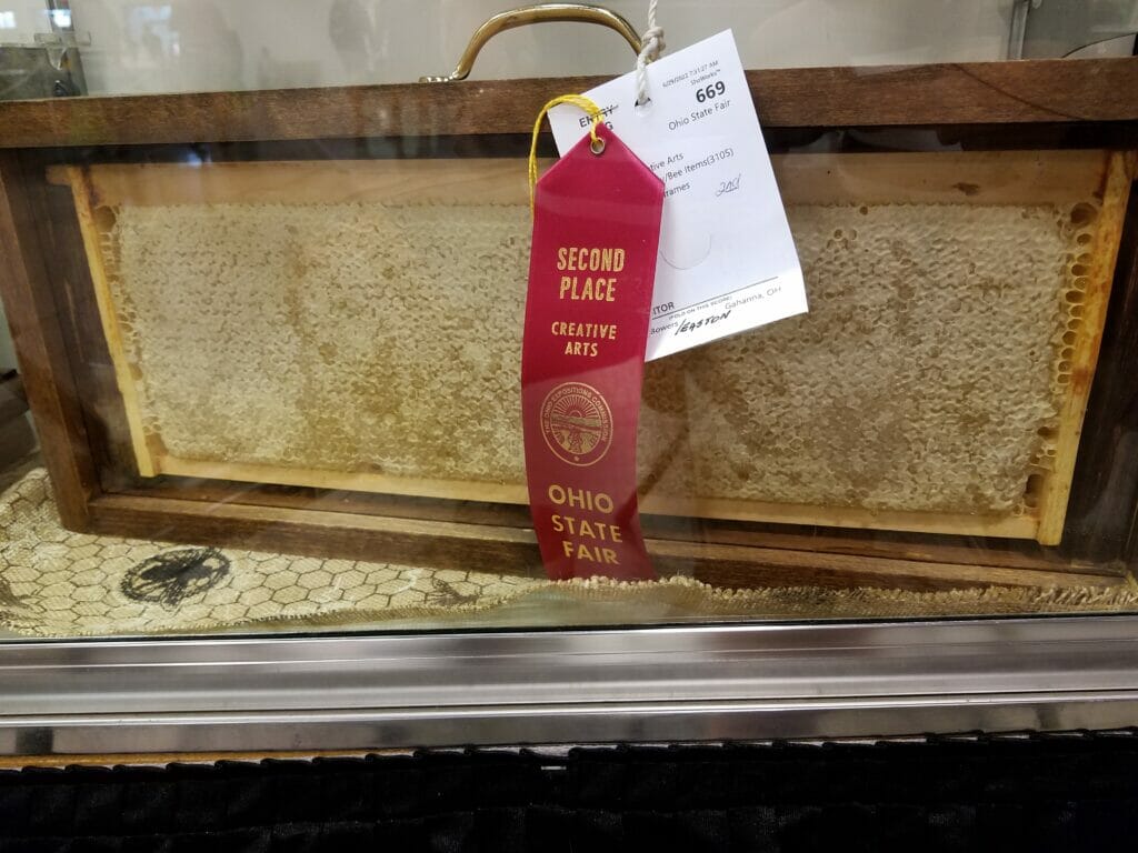 A frame of Easton honey on display at the Ohio State Fair with a Second Place award ribbon on it.
