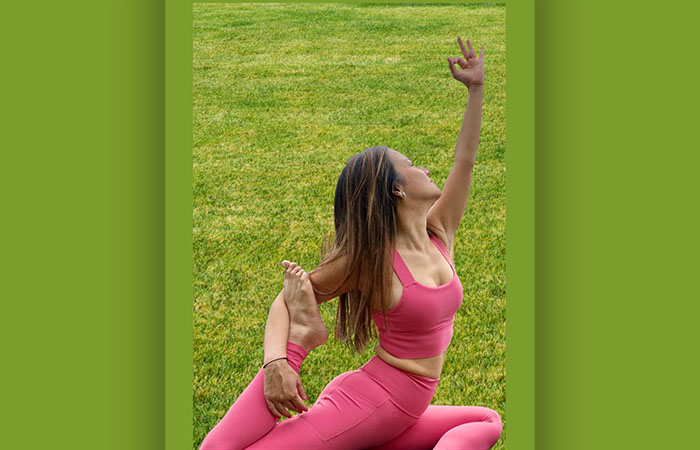 A girl holding a yoga pose.