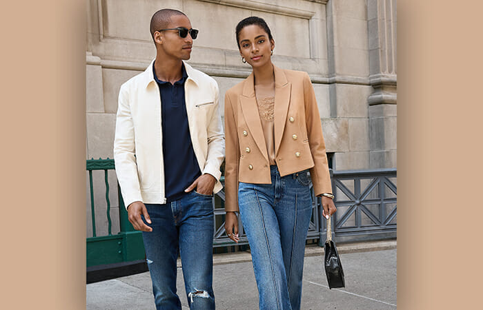 A man and a woman wearing Express jeans.