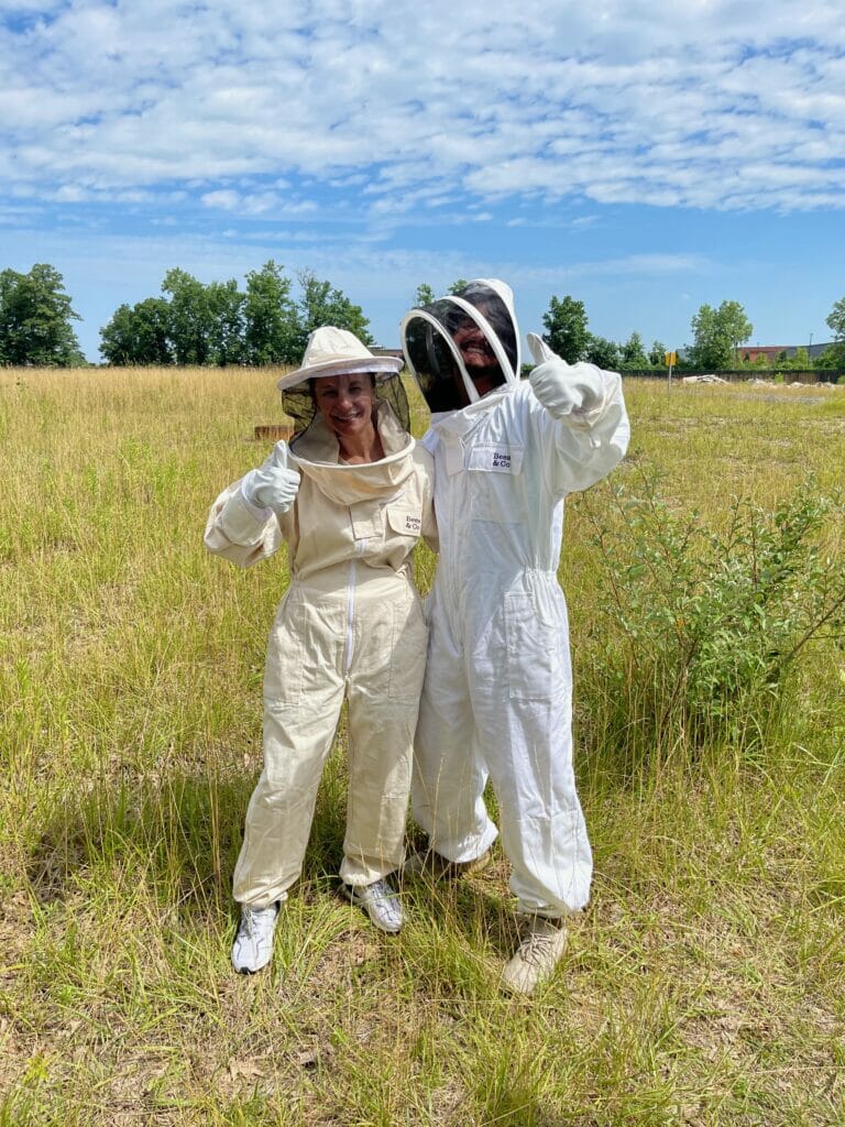 Two Easton employees in Bee suits.