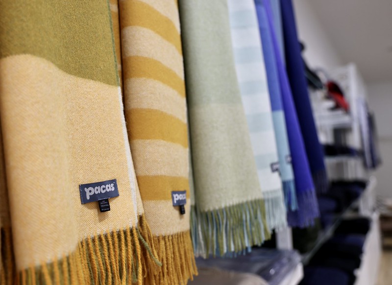 Close up of alpaca wool scarves displayed in store.