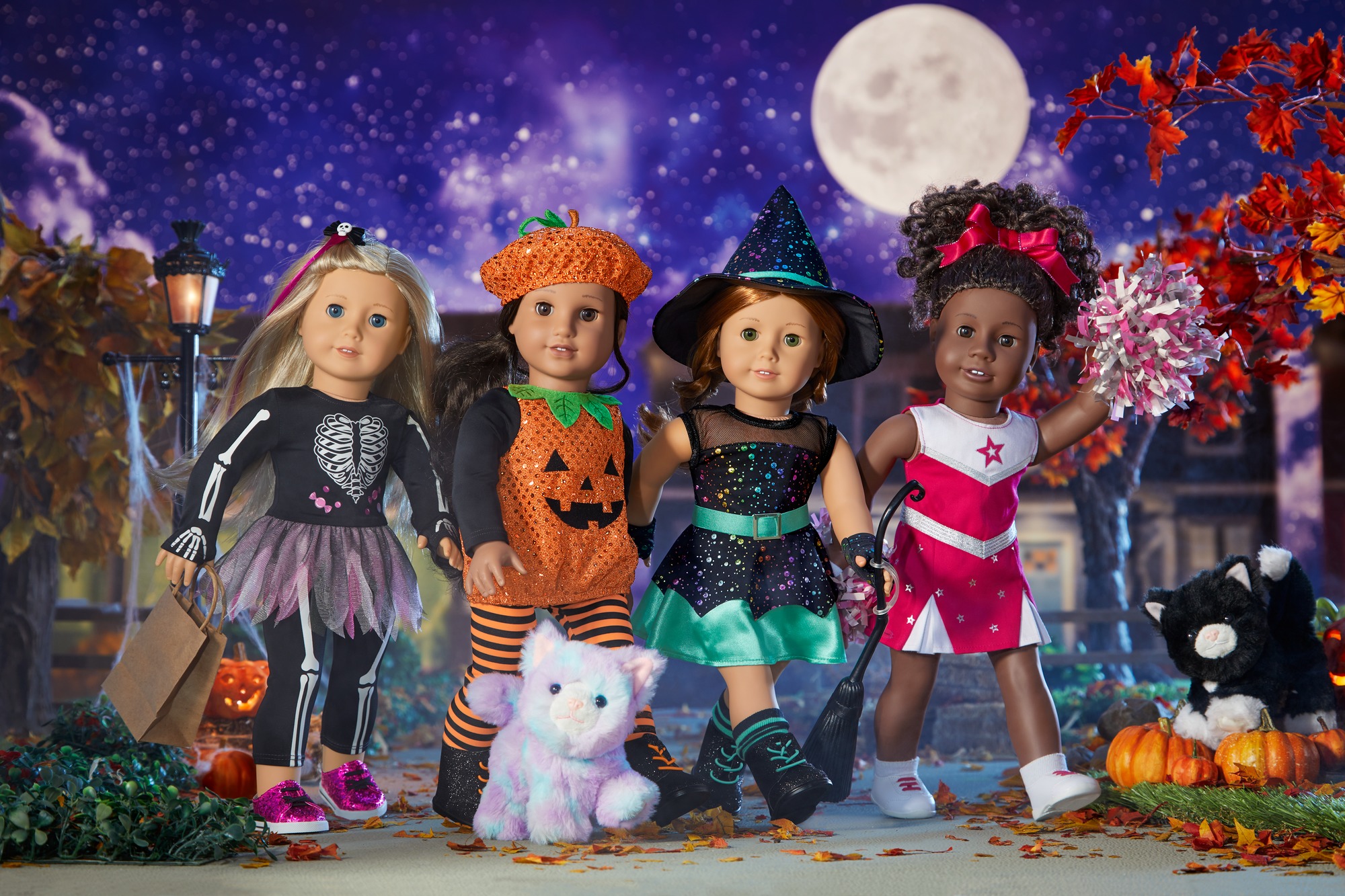 American Girl Dolls dressed up in Halloween costumes.