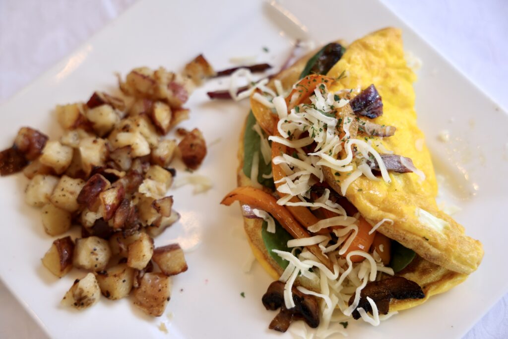 Spring Omelet at Fay's Crepes with a side of breakfast potatoes
