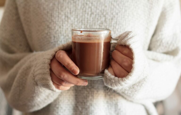 Someone holding a cup of hot chocolate.