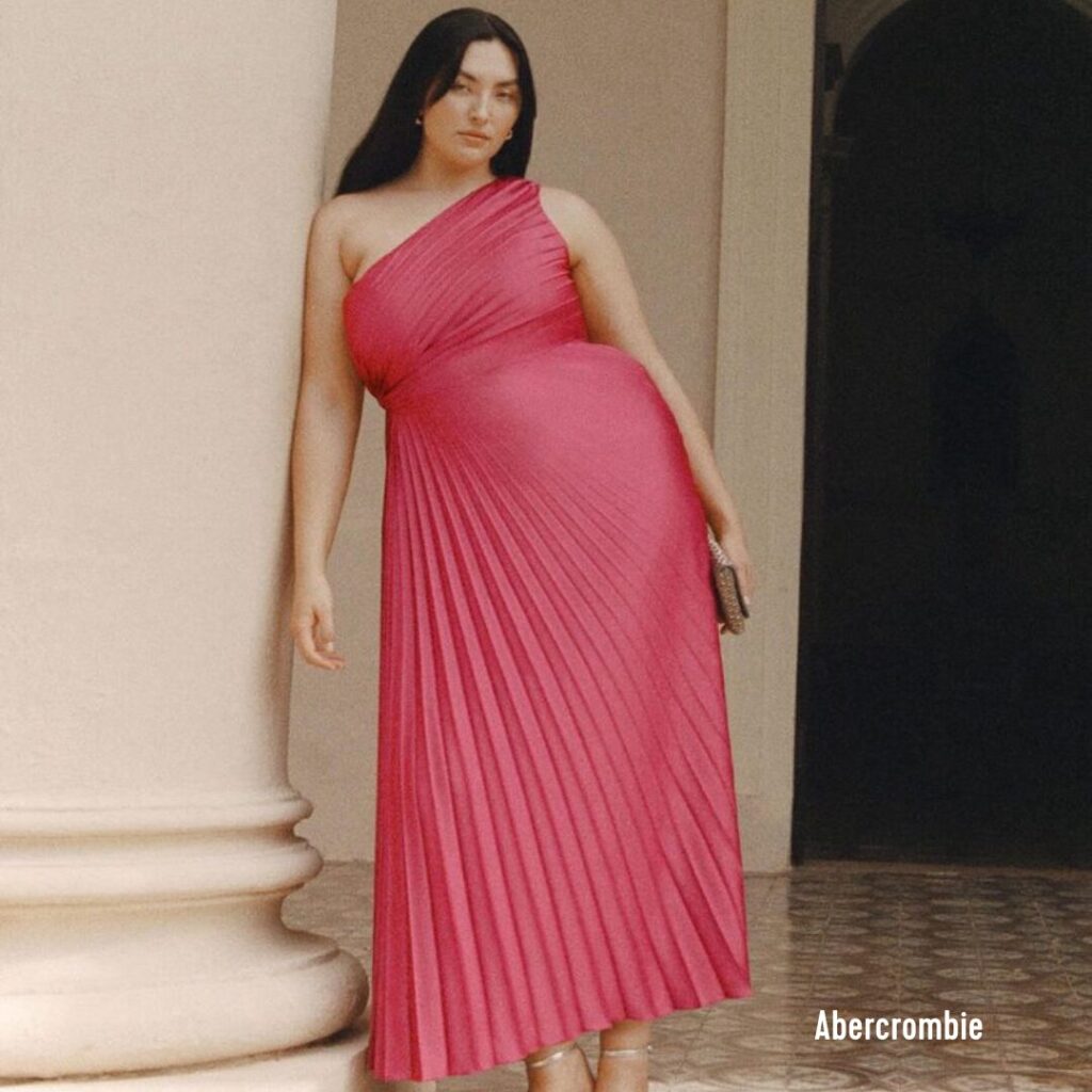 A woman wearing a pink dress from Abercrombie.