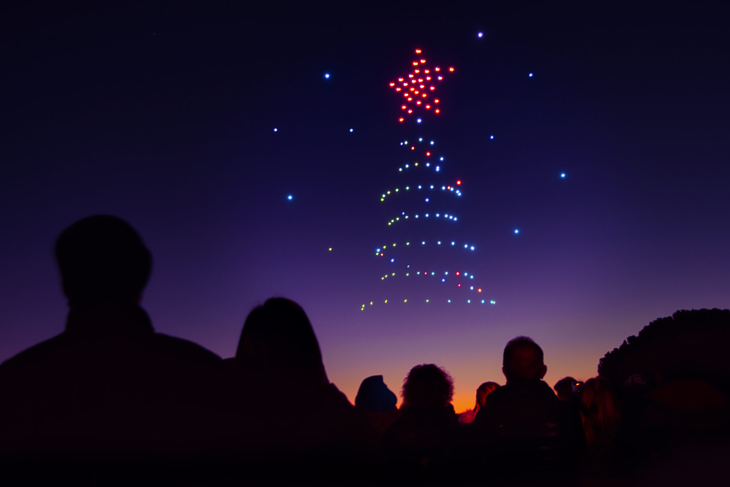 An image of a holiday tree depicted by drones during a holiday drone show.