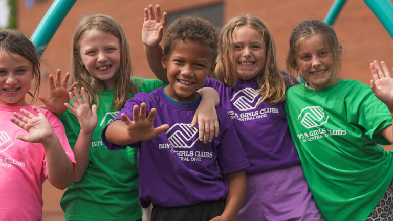 boys and girls club of central ohio group of kids wearing logo shirts