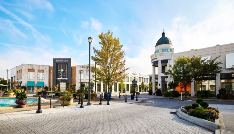 An outside image of the Louis Vuitton, Gucci, and Tiffany's stores at Easton town center.