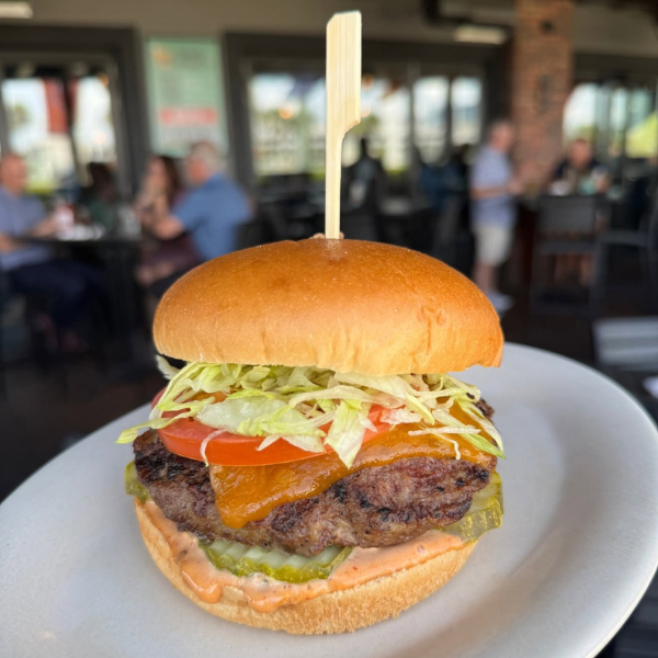 A burger on a plate from World of Beer.