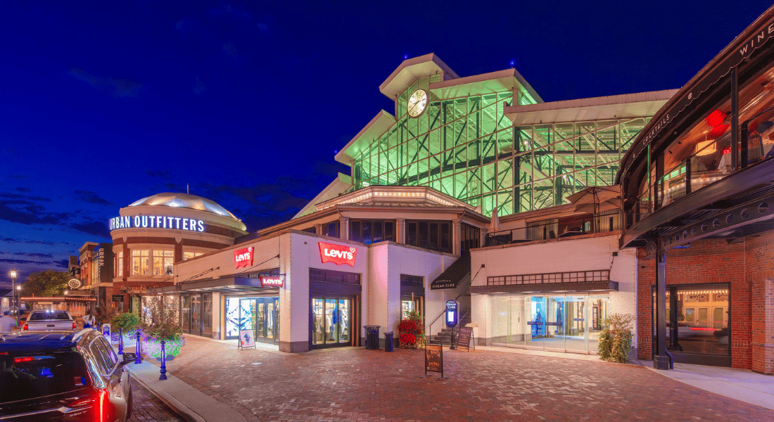 The Easton Station Building at night lit up green.