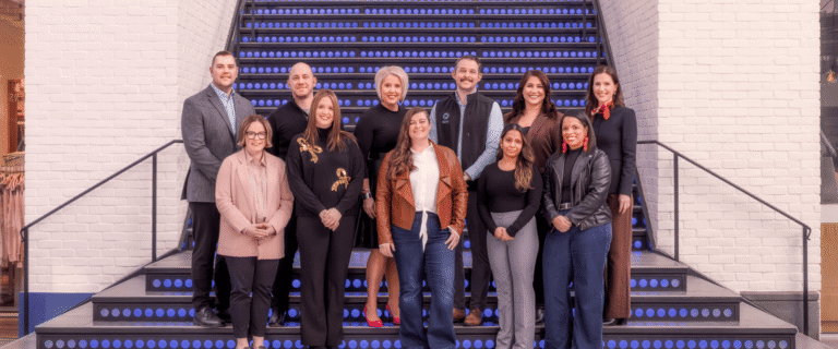 The 2026 Easton Community Foundation partners standing on the Grand Staircase for a group photo at Easton, along with two Easton representatives.