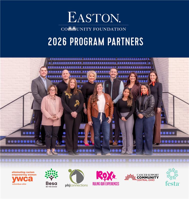 The 2026 Easton Community Foundation partners standing on the Grand Staircase for a group photo at Easton, along with two Easton representatives. The logos of the non-profit partners are overlayed at the bottom of the image.