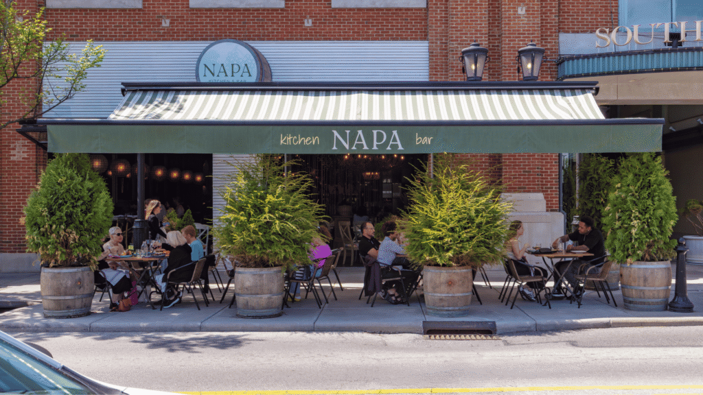 People dining on the patio at NAPA Kitchen & Bar at Easton.