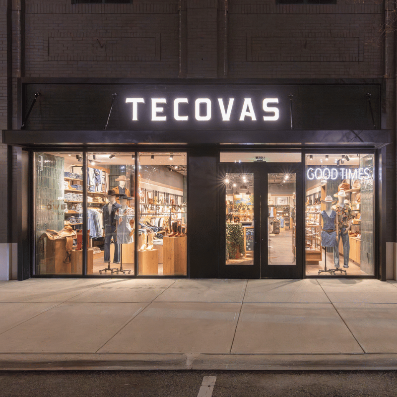 The Tecovas storefront at night at Easton.