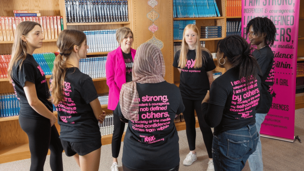 A group of girls and a ROX leader having a group discussion.